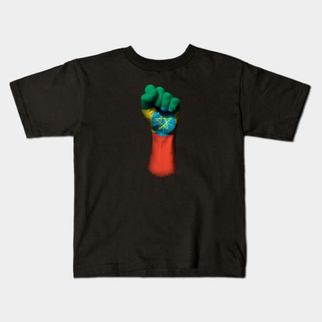 Flag of Ethiopia on a Raised Clenched Fist Kids T-Shirt by jeffbartels